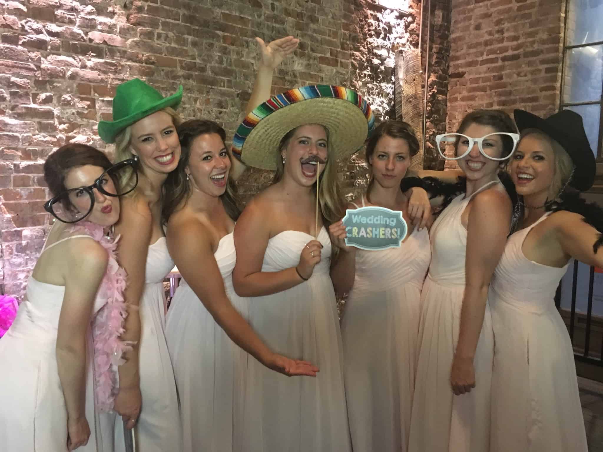 Bridal party with photo booth props North Kansas City